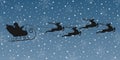 Santa on sleigh with reindeer flying in the night sky. Christmas background with Santa`s sled and Xmas deer. Winter background Royalty Free Stock Photo